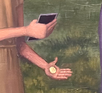 Woman's hand releasing a gold coin into the well